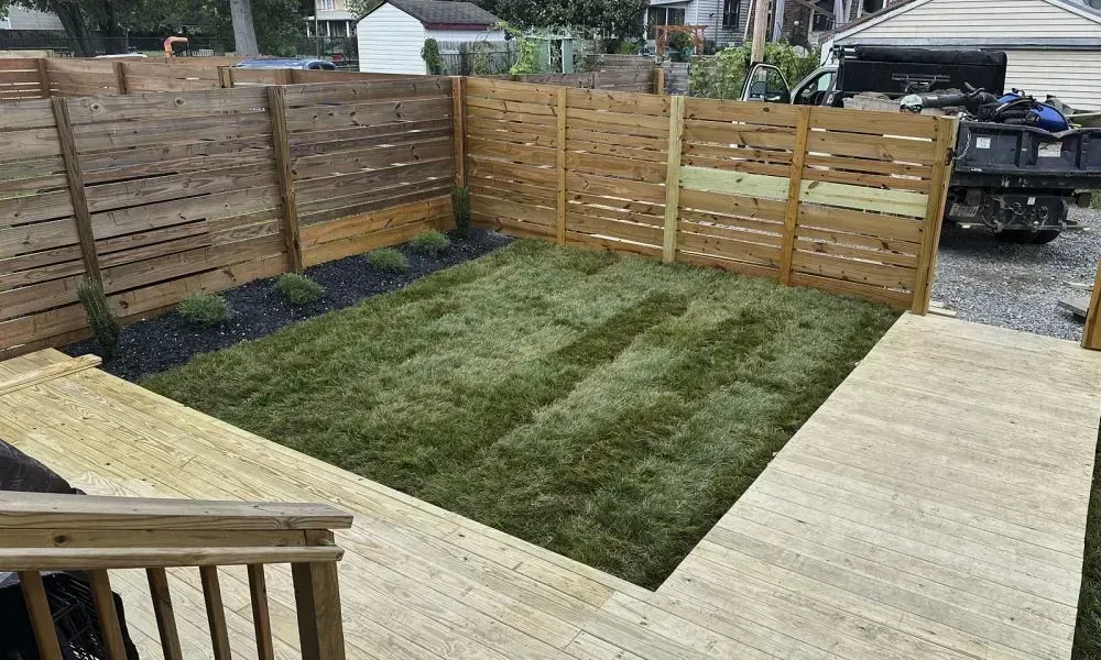 View of an excellent outdoor landscaping in a garden outside a house with newly constructed wooden