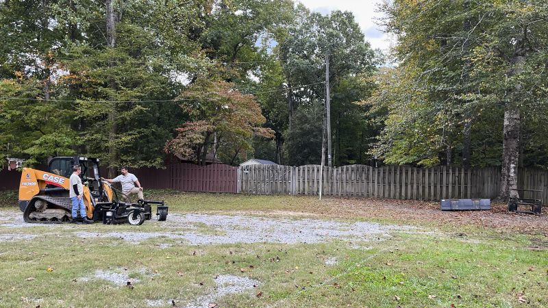 A Wide Angle Shot Of Two Landscape Grading Professionals Discussing On The Site Before The Yard Leveling Process
